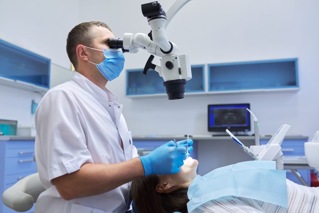 Healthcare dentistry medicine, male doctor dentist treating teeth