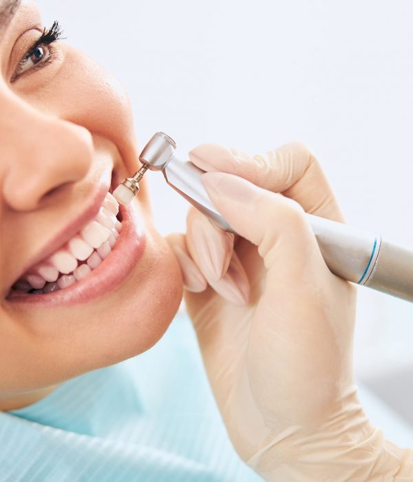 close-up-of-kind-woman-doing-teeth-cleaning.jpg